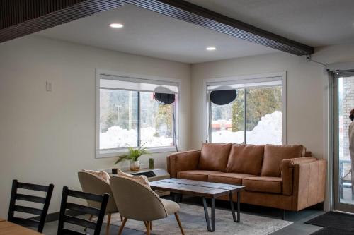 a living room with a couch and a table at Super 8 by Wyndham Clearwater BC in Clearwater