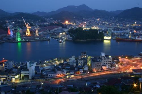 a view of a city at night at Onomichi View Hotel Seizan in Onomichi