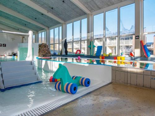 a water park with a pool with toys in the water at Søndervig Holiday Center in Ringkøbing