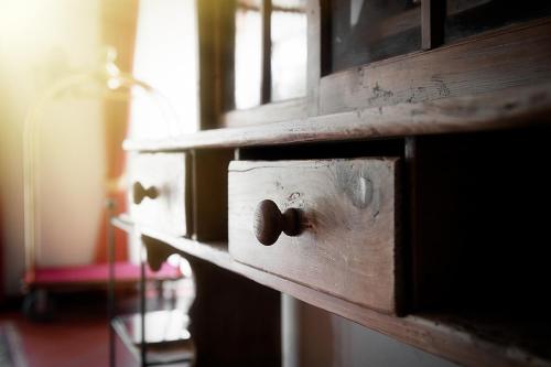 a close up of a wooden drawer with a knob at Relais Picaron in San Daniele del Friuli