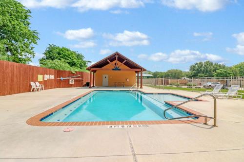 a swimming pool with a gazebo at Cliffside Paradise Waterfront in New Braunfels