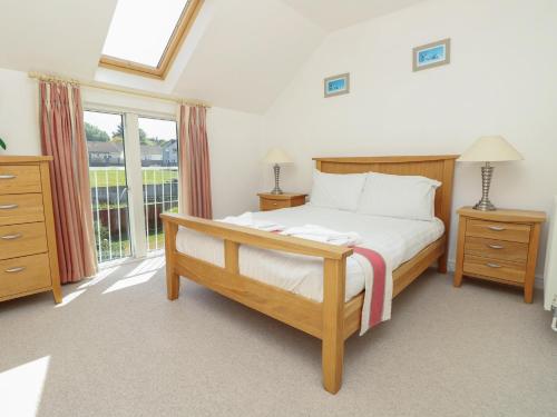 a bedroom with a bed and a large window at Delaware M2 in Yarmouth