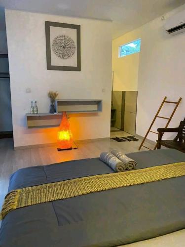 a bedroom with a bed with a fire in it at WHITE SANDS RESORT in Gili Trawangan