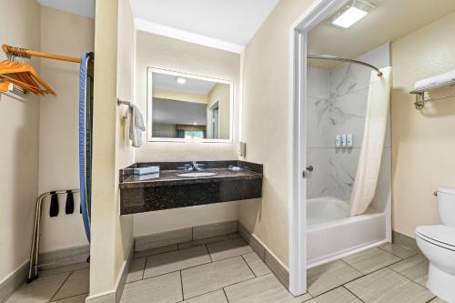a bathroom with a sink and a toilet at Quality Inn & Suites Hesperia-Victorville in Hesperia