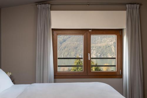Llit o llits en una habitació de Hotel Saligari