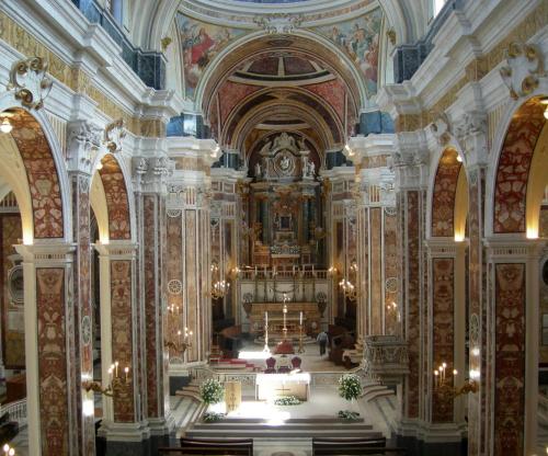 a large church with a altar in the middle at Palazzo Kapece in Monopoli