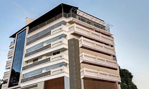 a tall building with balconies on top of it at Itsy Hotels Dew Dreams in Cochin