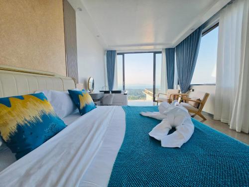 a large bedroom with a large bed with a large window at Ocean Big Tiger Villa-6 Bedrooms with Ocean View Private Pool in Nathon Bay