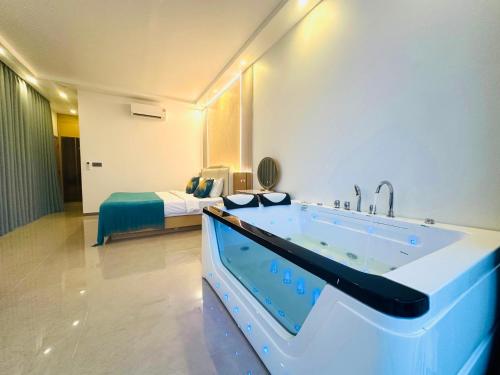 a bath tub in a room with a bed at Ocean Big Tiger Villa-6 Bedrooms with Ocean View Private Pool in Nathon Bay
