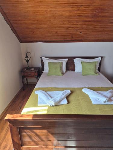 a bedroom with a bed with two towels on it at Apartment Mirjana in Kotor