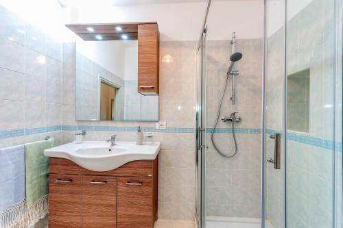 a bathroom with a sink and a shower at Casa in Via Seminario Otranto in Otranto