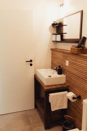 a bathroom with a white sink and a mirror at Fun & Relax Park Thurnau in Thurnau