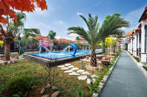 a pool at a resort with a water park at Hoa Lư - An Resort in Ninh Binh