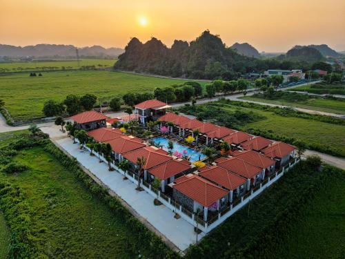 an aerial view of a resort with a swimming pool at Hoa Lư - An Resort in Ninh Binh