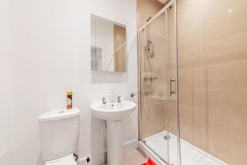 a bathroom with a toilet sink and a shower at Sleeps 2 - Central - Studio - WiFi - Paid Parking in Maidstone