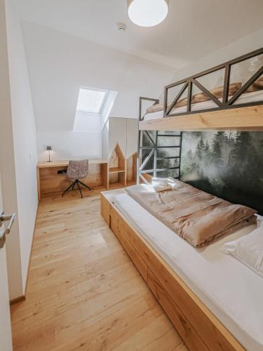 a bedroom with a bunk bed and a desk at Cozy Corner in Bovec