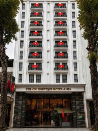 a large white building with a hotel at The Chi Boutique Hotel in Hanoi