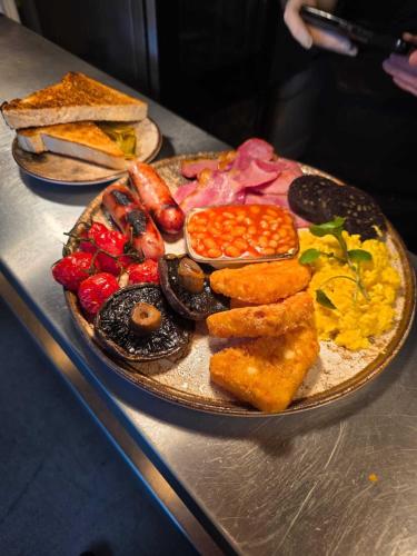 a plate of breakfast food on a table at The Linden Tree in Gloucestershire