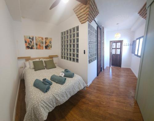 a bedroom with two beds with pillows on it at Cathedral Suite Jaén in Jaén