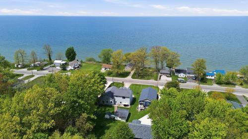 an aerial view of a house near the ocean at Lake Rd E- Geneva in Geneva