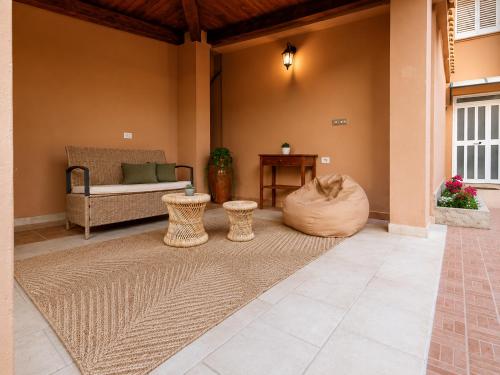 a living room with a couch and a table at Almarea Apartments in Santa Domenica