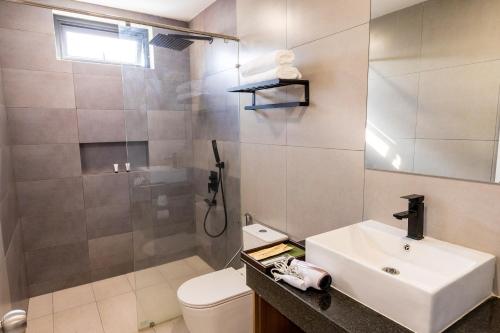 a bathroom with a sink and a toilet at Walk Street Hotel & Apartment in Phnom Penh