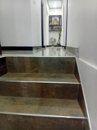 a set of stairs with a glass counter top at Trailside Homestay in Badulla