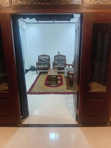 a view of a living room from inside a glass door at Trailside Homestay in Badulla