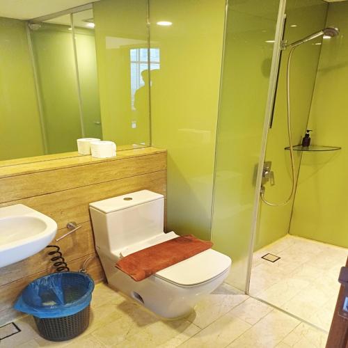 a bathroom with a toilet and a shower and a sink at vortex klcc by IOI HOME management in Kuala Lumpur