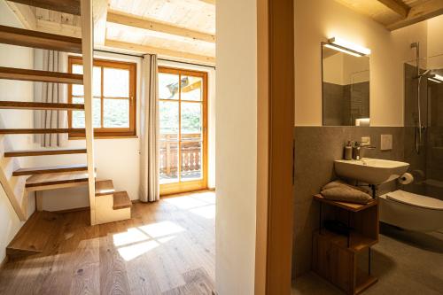a bathroom with a sink and a toilet at Lechnerhof in Plaus
