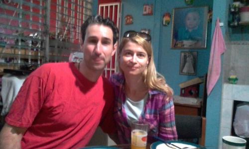 a man and a woman sitting at a table at Casa Blanca Tu Casa in Santa Ana