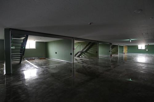 an empty room with a staircase in a building at Inca Motel in Daejeon