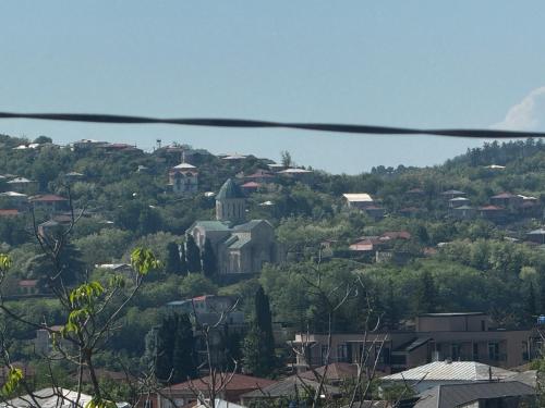 a view of a city from the top of a hill at Terrasa Solar Kutaisi in Kutaisi