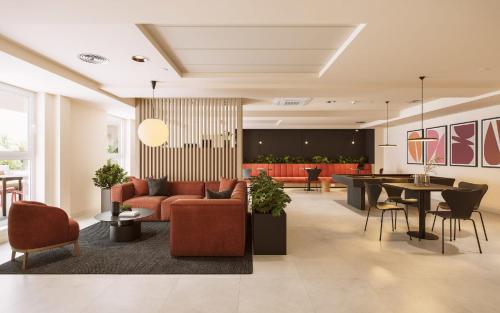 a lobby with a couch and chairs and a table at Straits Place in Edinburgh in Edinburgh