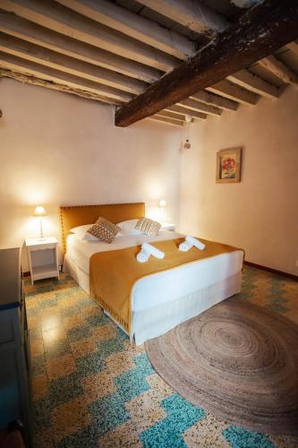 a bedroom with two beds in a room at Vivez Bonifacio - Sous le charme in Bonifacio