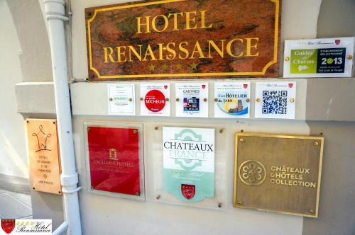 a sign for a hotel reassurance on a wall at Hôtel Renaissance in Castres