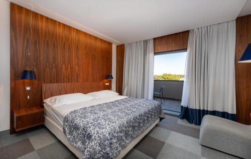 En eller flere senge i et værelse på Hotel IN