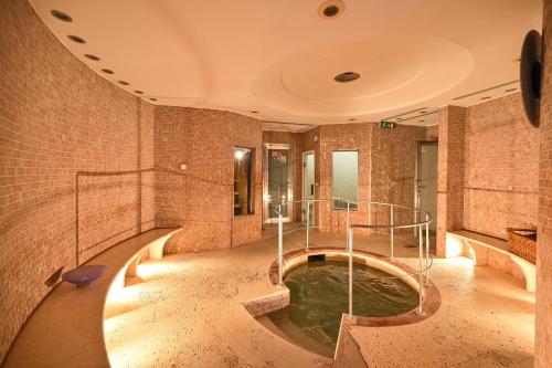 a large bathroom with a pool of water at Grand Hotel Delle Terme Re Ferdinando in Ischia Town
