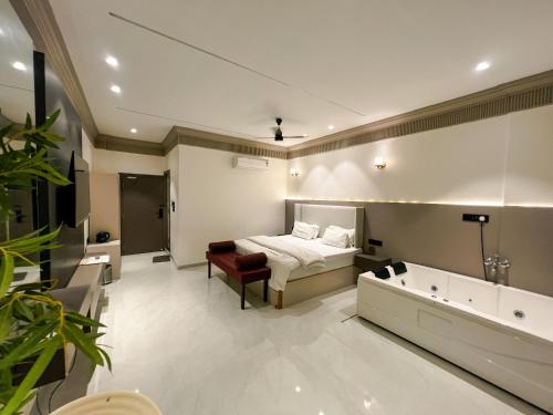 a bedroom with a bed and a bath tub at Kshitij 5 bros in Vasai