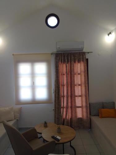 a living room with a couch and a table and a window at Bella Vista renovated in Istro