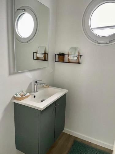 a bathroom with a sink and a mirror at AURORA in Lübeck