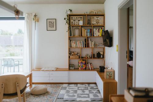 a room with a book shelf with books at Druhej Domek u ráje in Bystřice