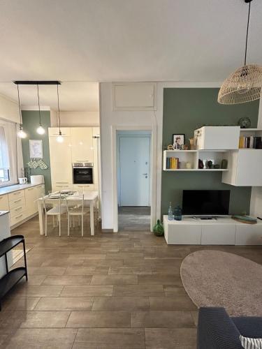 a living room with a kitchen and a dining room at Casa Angiolina in Chiavari