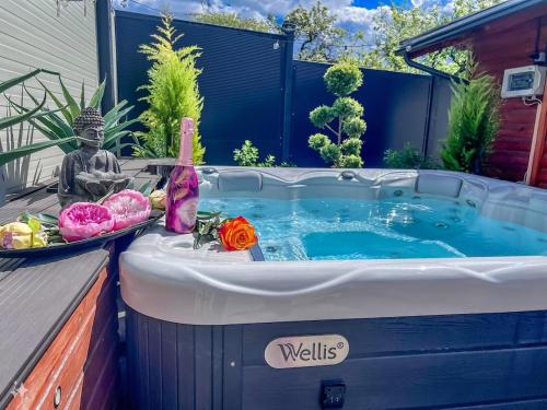 a jacuzzi tub in the backyard of a house at Aura Luxury Suites Bled in Bled