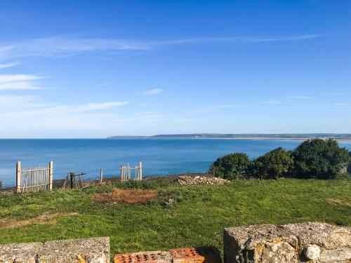 a view of the ocean from the top of a hill at Twenty One in Westward Ho