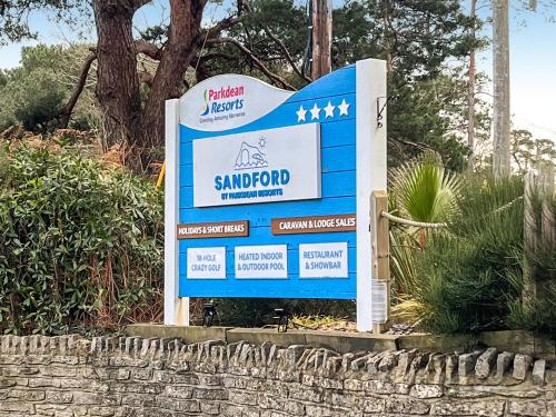 a sign for a ski resort on a street at 5 Pine Rise in Poole