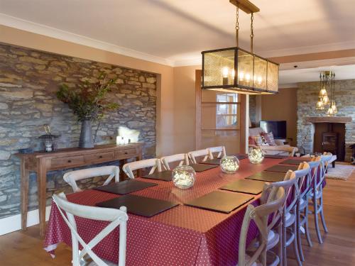 a dining room with a table and chairs at Fountain Hill in Eglwyswrw