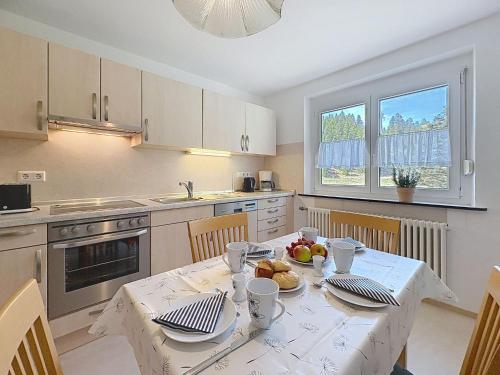 a kitchen with a table with food on it at Apartment Fischer by Interhome in Eisenbach