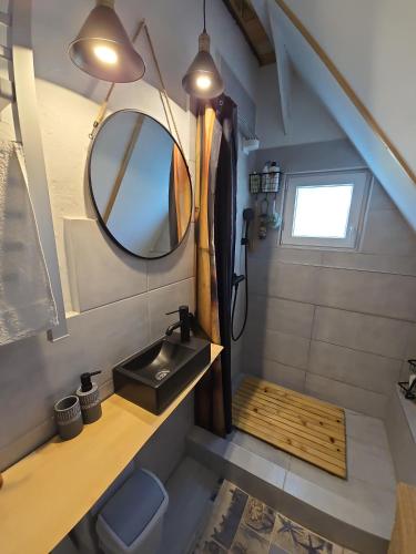a bathroom with a sink and a mirror at Solarna Eko Vila - Your Boutique Mountain Escape in Divčibare
