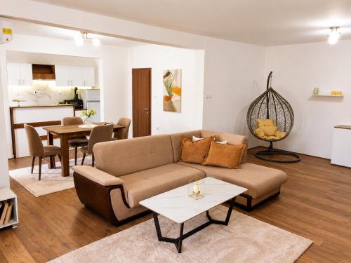 a living room with a couch and a table at Vila Elena in Gevgelija